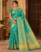 Teal green and gold floral saree with ornate pallu and unstitched blouse piece