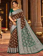 Chocolate brown saree with emerald green pallu and ornate floral border, unstitched blouse included