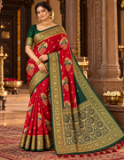 Red saree with emerald green and gold peacock design, ornate border and pallu