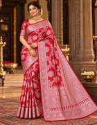 Red saree with silver-tone floral motifs and ornate border, unstitched blouse piece included